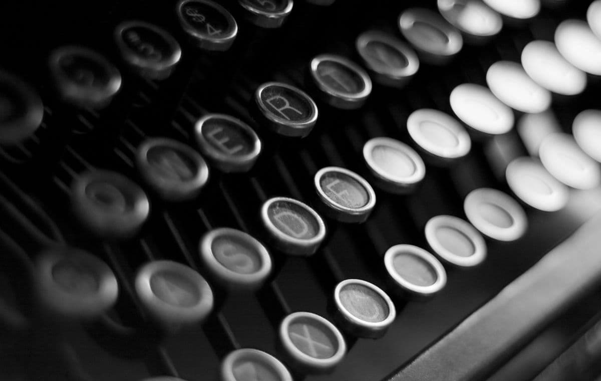 Close-up of vintage typewriter keys in black and white