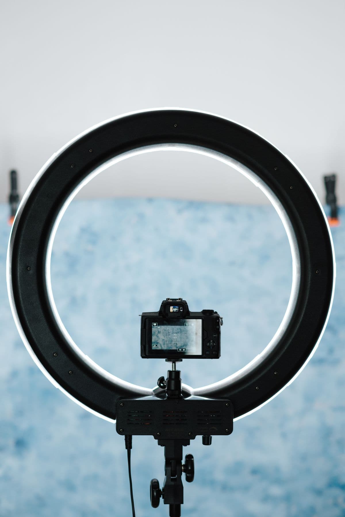 A ring light and camera set up for video recording